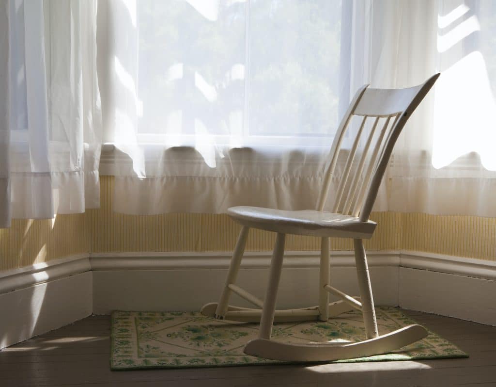 Antique Rocking Chair by a bay window