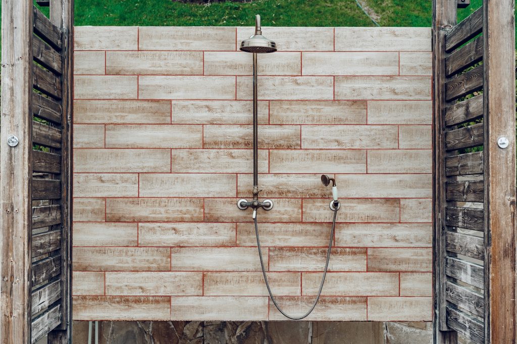 Outdoor rain shower in resort hotel close up